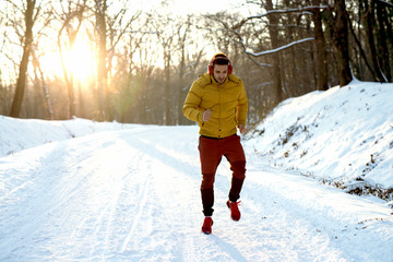 Morning fitness training at the snowy mountain.