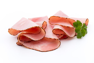 Thin slices of ham on white background.