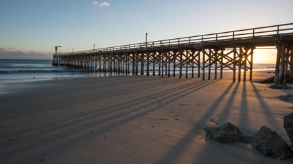 Pier with Reflection During Sunset and Low Tide in Gaviota State Park, California