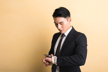 man use smart watch and phone