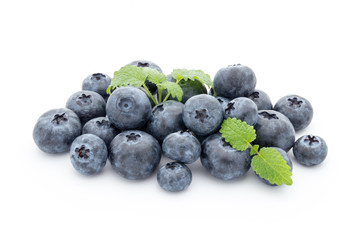Close up of a blueberry branch isolated over white.