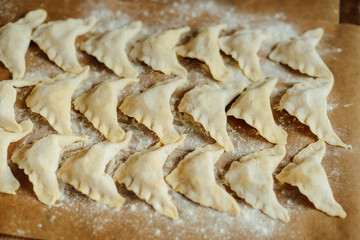 Making of pierogi with potato Vareniki. Russian food . Rustic
