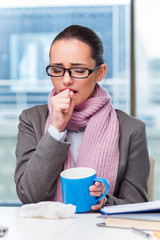 Young businesswoman sick in the office