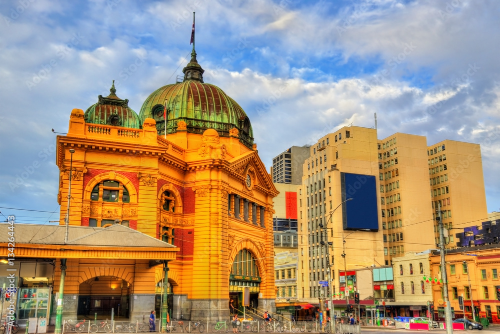 Poster flinders street railway station, an iconic building of melbourne, australia