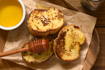 French toast made of baguette with honey, photographed overhead with natural light