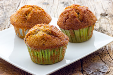 Muffins on a wooden table