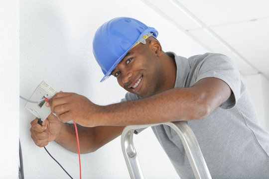 Portrait of electrician wiring