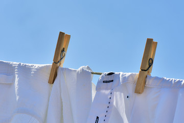 Clothes drying on the clothesline under the blue sky