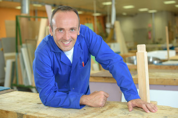 carpenter posing in workshop