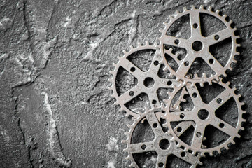 concept hour metal gears on dark background top view