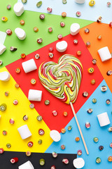 Fototapeta premium lollipops, candy pattern, top view flat lay on colorful background