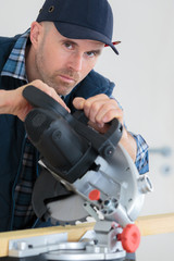 worker and drop saw