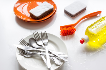 concept of washing dishes on white background