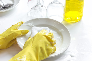 concept of woman washing dishes on white background