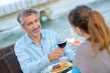 Couple toasting with wine glasses