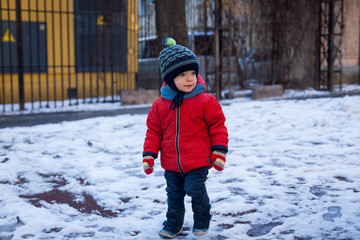 Fototapeta na wymiar Little boy with blue eyes on a winter walk.