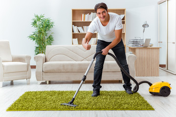 Man husband cleaning the house helping wife