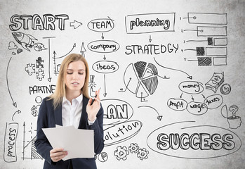 Businesswoman with papers and startup on concrete