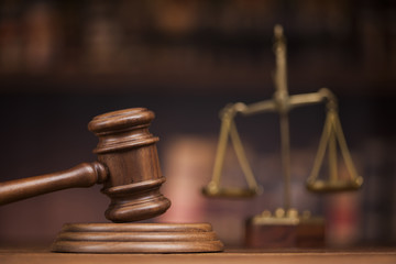 Law books, mallet of the judge, Courtroom background