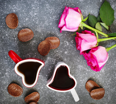 Heart shaped cup of tea and chocolate candy. Valentines day concept
