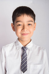 Portrait of little boy wear white shirt school uniform