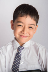 Portrait of little boy wear white shirt school uniform