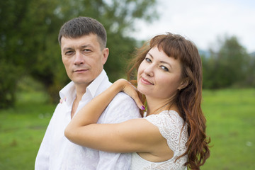 Lovers man and woman on a date in nature.