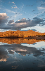 Obraz premium Mountain Water Reflection on Lake During Sunset