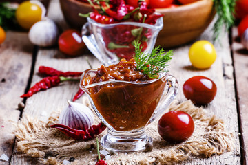 Fototapeta na wymiar Adjika - traditional Armenian spicy sauce from tomatoes, bell pe