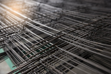 Wire mesh steel for construction put a pile on the ground.