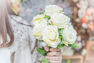 Hands holding bouquet of flower