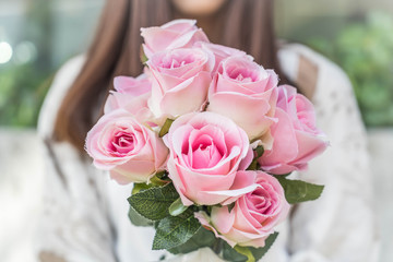Hands holding bouquet of flower