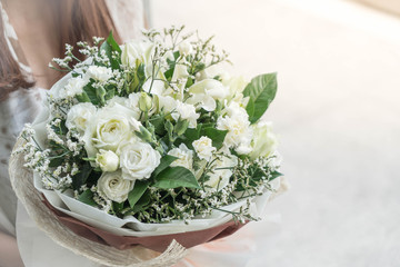 Hands holding bouquet of flower