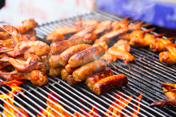 hot grill chicken wing BBQ grilled on fire Asian Thai style