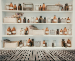 blurred  Image Spa collage series ,wood table shelf Bottle of massage oil in sPa