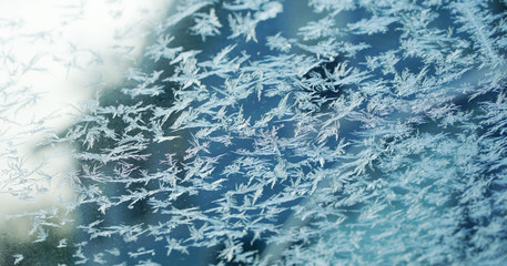 frost crystal on window glass in winter season