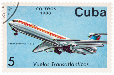 Passenger airplane Ilyushin IL-62 on postage stamp