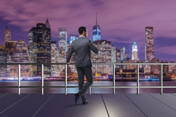 Businessman with laptop in business concept