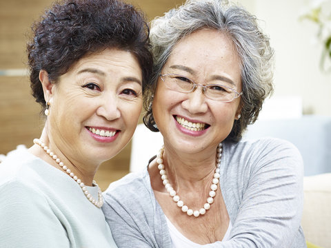 Portrait Of Two Happy Smiling Asian Senior Women