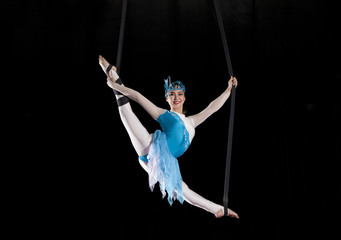 Young woman circus air gymnast