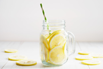 lemonade in jar with green straw