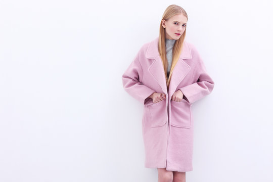 Young Elegant Woman In Trendy Pink Coat.