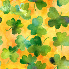 Seamless pattern with watercolour shamrocks on golden