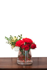 beautiful red roses on wooden table