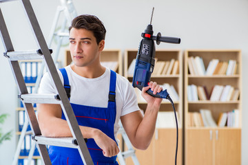 Repairman working with drilling drill perforator