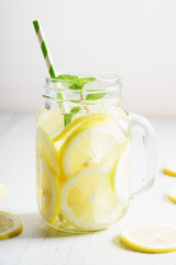 lemonade in jar with green straw