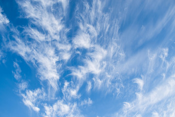Beautiful white clouds on bright blue sky in winter