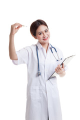 Young Asian female doctor with thermometer and clipboard.