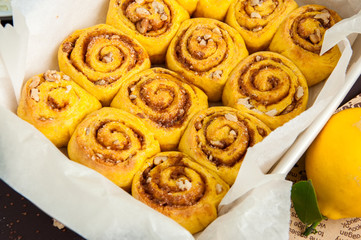 Freshly baked pumpkin turmeric cinnamon swirl buns in baking form