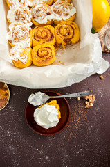 Freshly baked pumpkin turmeric cinnamon swirl buns in baking form